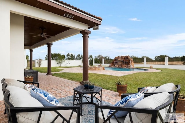 view of patio with a fenced in pool and ceiling fan