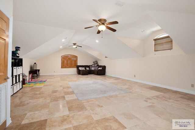 additional living space featuring ceiling fan and vaulted ceiling