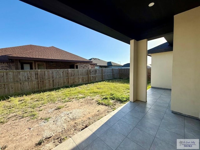 view of yard with a patio area and a fenced backyard