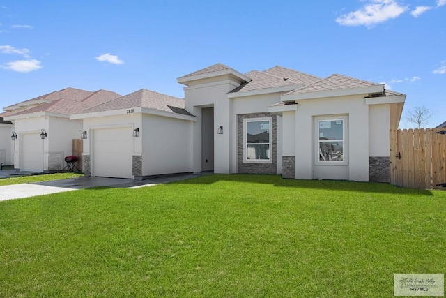 view of front facade featuring concrete driveway, stone siding, an attached garage, fence, and a front lawn