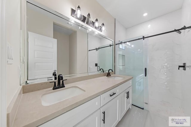 full bath featuring double vanity, a marble finish shower, and a sink