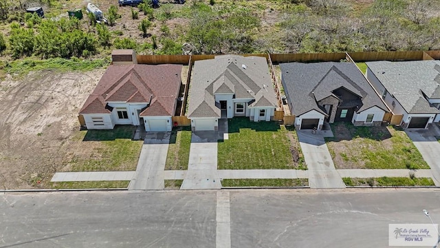 birds eye view of property with a residential view