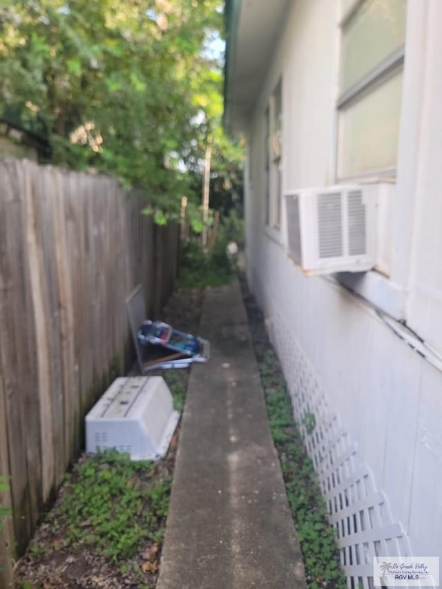 view of home's exterior with cooling unit