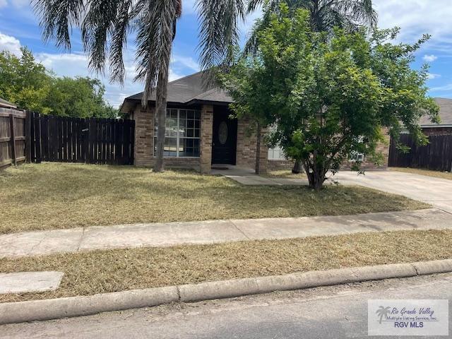 obstructed view of property with a front yard