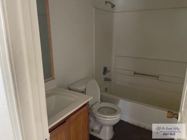 full bathroom featuring vanity, toilet, and washtub / shower combination