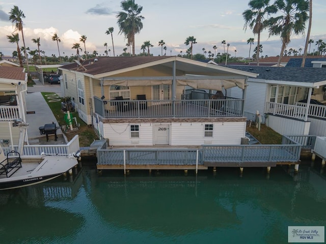 269 Cockle Dr, Port Isabel, TX 78587 - back of house featuring a water view