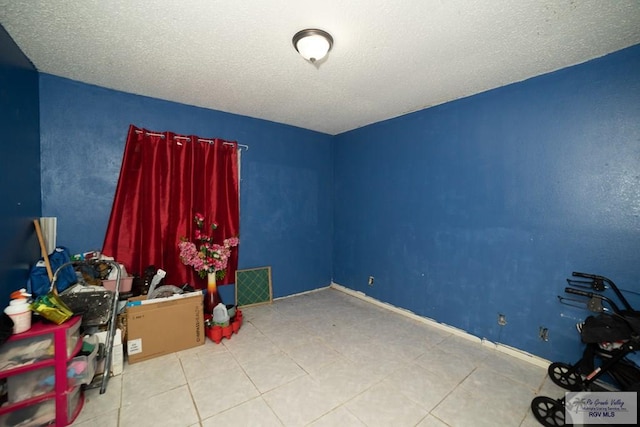 misc room featuring a textured ceiling