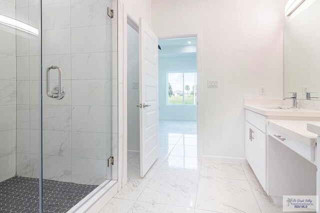 bathroom with vanity and walk in shower