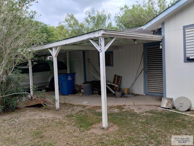 335 Edwards St, San Benito, TX 78586 - view of parking with a carport