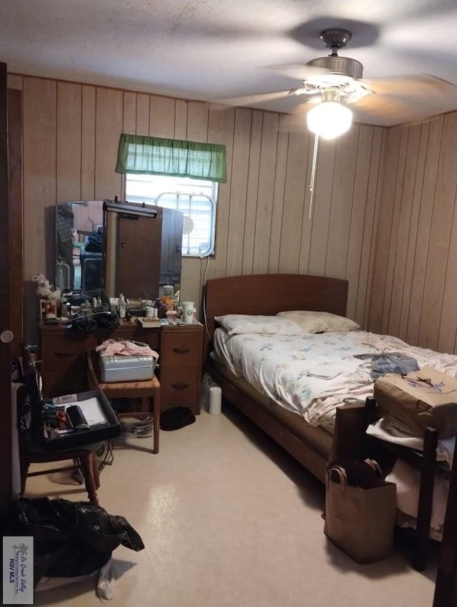 335 Edwards St, San Benito, TX 78586 - bedroom with wooden walls and ceiling fan