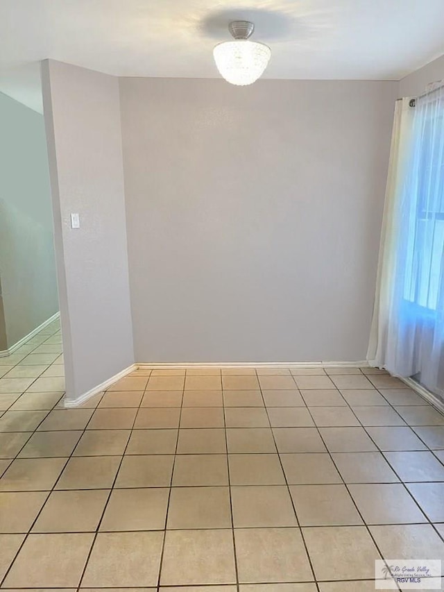 122 Regency Ct, Harlingen, TX 78550 - unfurnished room featuring light tile patterned floors and baseboards
