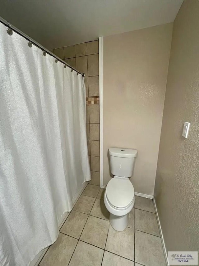 122 Regency Ct, Harlingen, TX 78550 - full bathroom with tile patterned floors and curtained shower