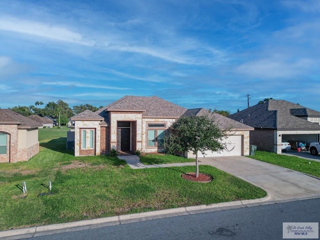 view of front facade featuring a front yard and a garage