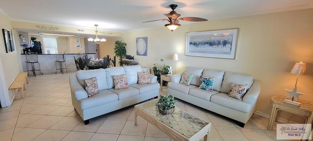 406 Padre Blvd Unit 401, South Padre Island, TX 78597 - living area featuring a chandelier, ornamental molding, a ceiling fan, and light tile patterned flooring