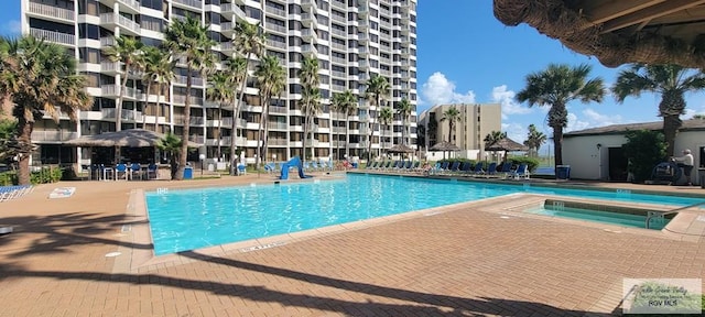 406 Padre Blvd Unit 401, South Padre Island, TX 78597 - community pool featuring a community hot tub and a patio area