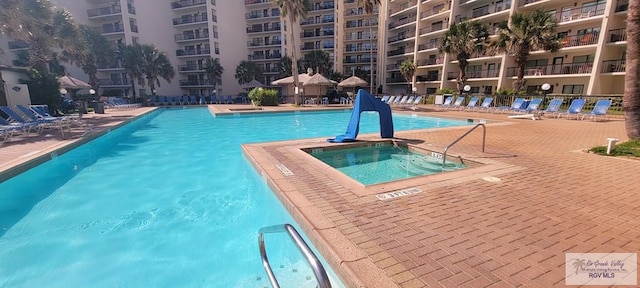 406 Padre Blvd Unit 401, South Padre Island, TX 78597 - community pool featuring a hot tub and a patio