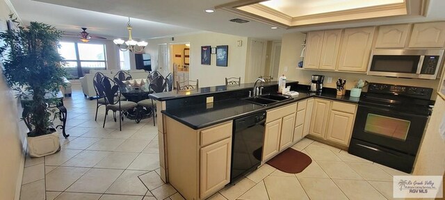 406 Padre Blvd Unit 401, South Padre Island, TX 78597 - kitchen featuring a sink, black appliances, crown molding, open floor plan, and a peninsula
