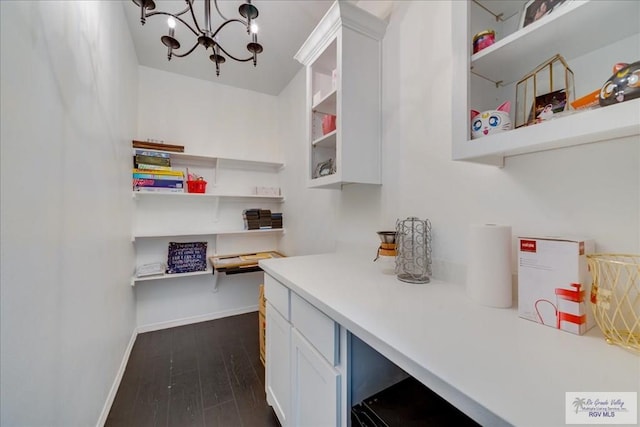 3213 E Westgate Cir, Harlingen, TX 78552 - spacious closet featuring dark wood-style flooring and a chandelier