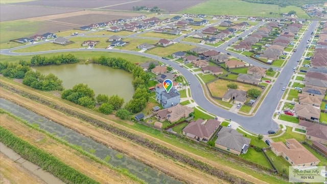 3213 E Westgate Cir, Harlingen, TX 78552 - aerial view of property's location with nearby suburban area and a large body of water