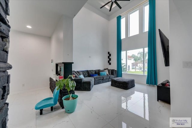 3213 E Westgate Cir, Harlingen, TX 78552 - living room with a towering ceiling, a ceiling fan, and recessed lighting