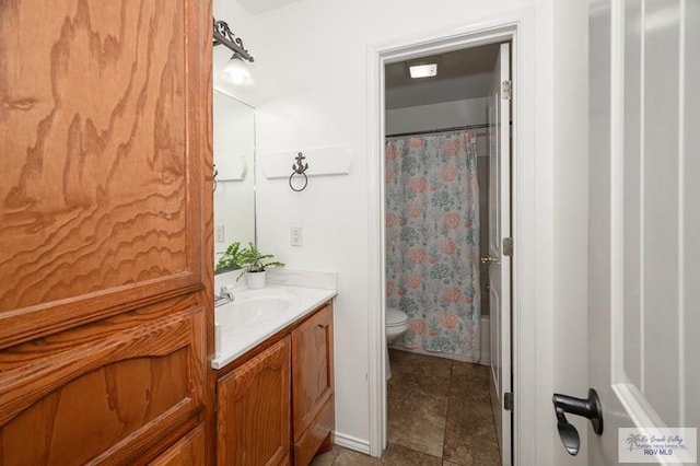 full bathroom with vanity, toilet, and shower / tub combo with curtain