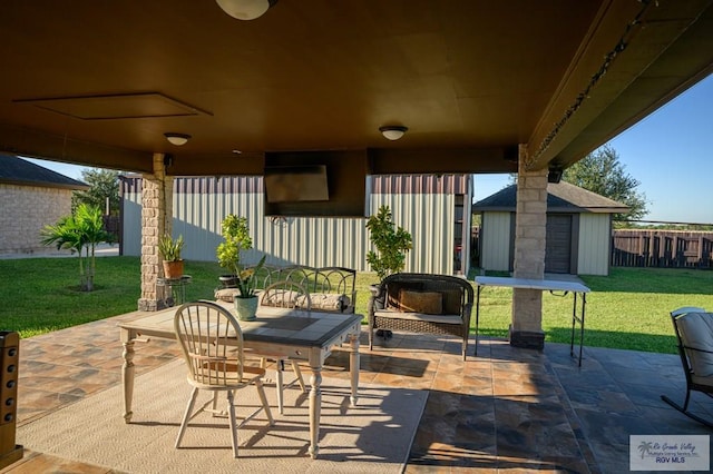 view of patio / terrace with a shed