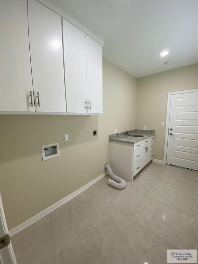 laundry area with cabinets, sink, washer hookup, and hookup for an electric dryer