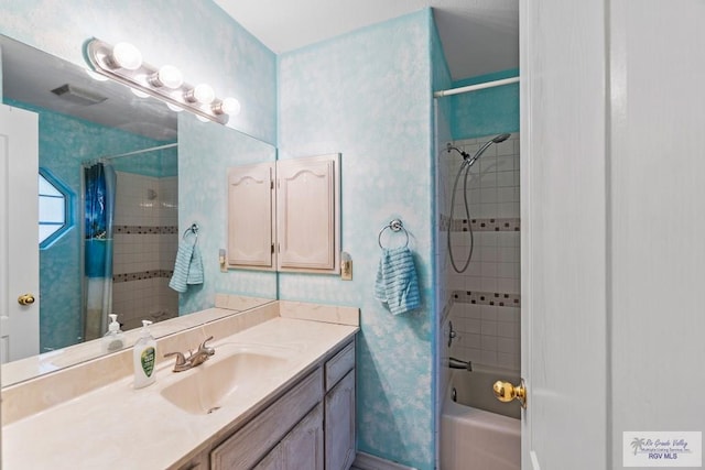 2518 Thomas Ln, Harlingen, TX 78550 - bathroom with vanity and shower / bathtub combination with curtain
