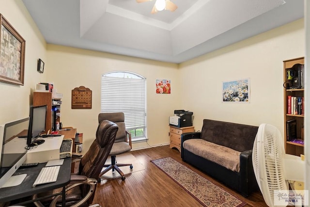 2518 Thomas Ln, Harlingen, TX 78550 - office space featuring a tray ceiling, a ceiling fan, and dark wood-type flooring