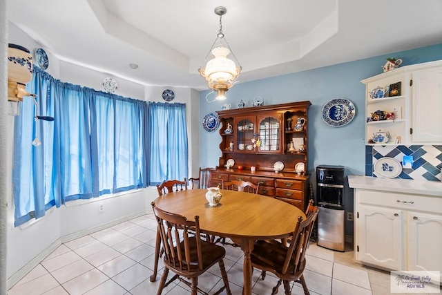 2518 Thomas Ln, Harlingen, TX 78550 - dining area featuring light tile patterned floors and a tray ceiling