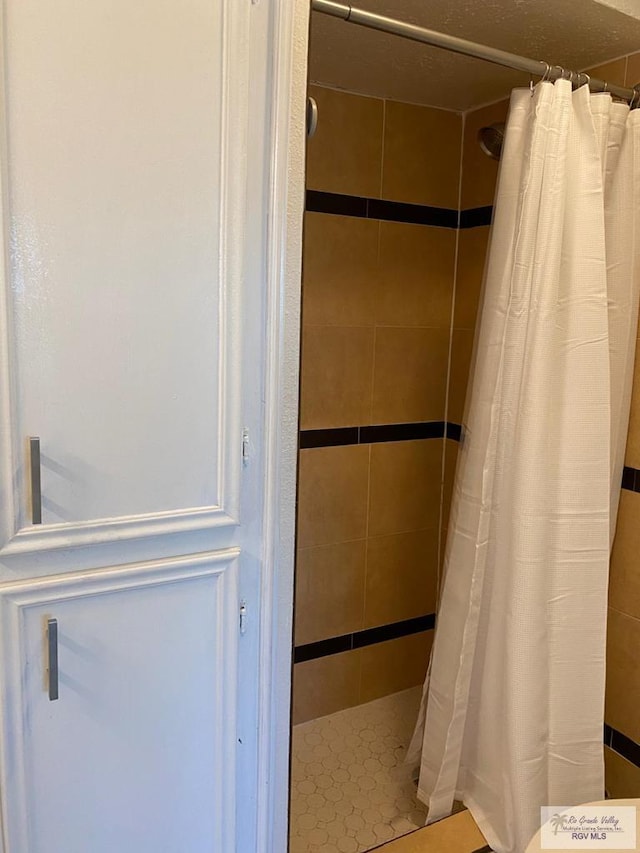 bathroom with a shower with curtain