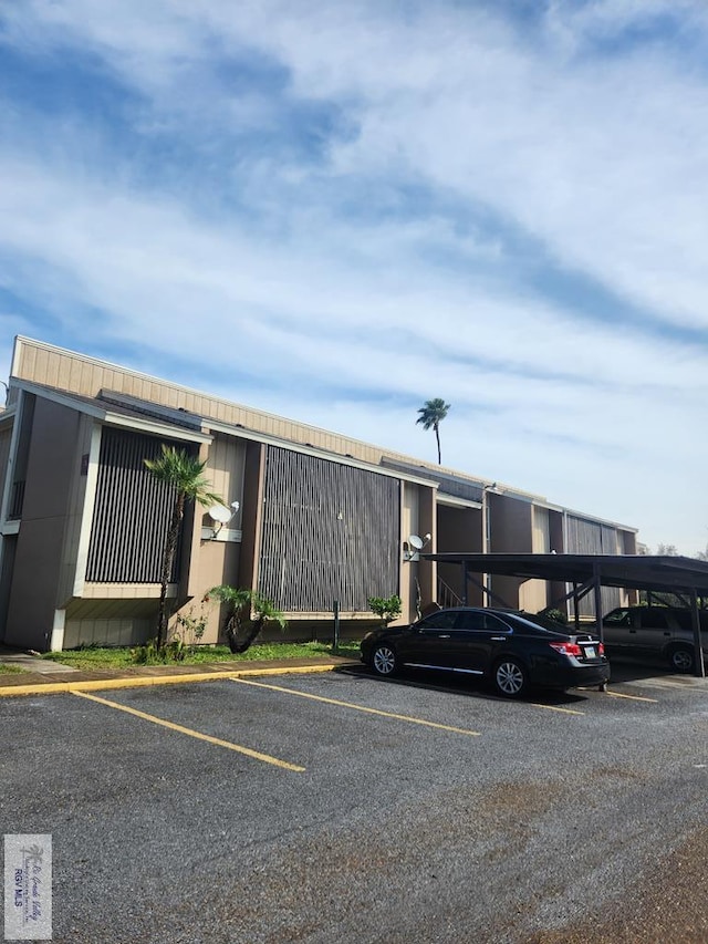 view of parking / parking lot with a carport