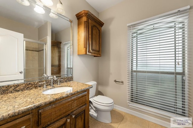 5302 Remington Dr, Harlingen, TX 78552 - full bathroom with vanity, tile patterned flooring, and tiled shower