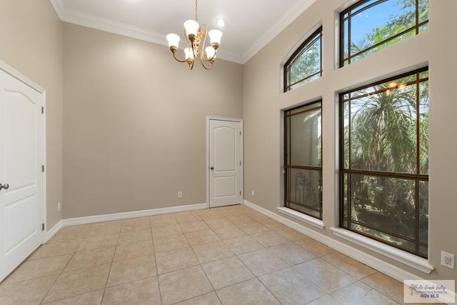 5302 Remington Dr, Harlingen, TX 78552 - unfurnished room featuring a chandelier, crown molding, a towering ceiling, and tile patterned flooring