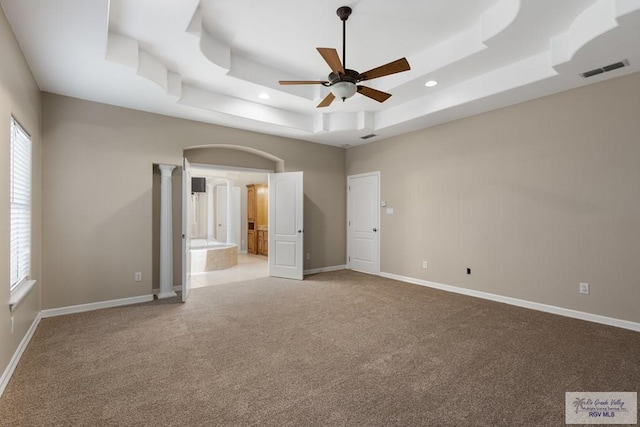5302 Remington Dr, Harlingen, TX 78552 - unfurnished bedroom with a tray ceiling, carpet flooring, recessed lighting, ensuite bath, and ceiling fan