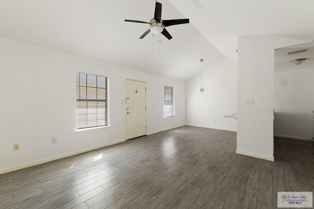 unfurnished living room with ceiling fan, dark hardwood / wood-style floors, and vaulted ceiling