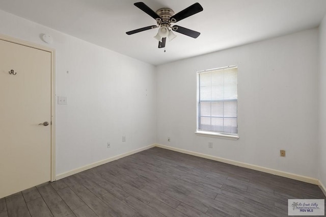 unfurnished room with ceiling fan and dark wood-type flooring