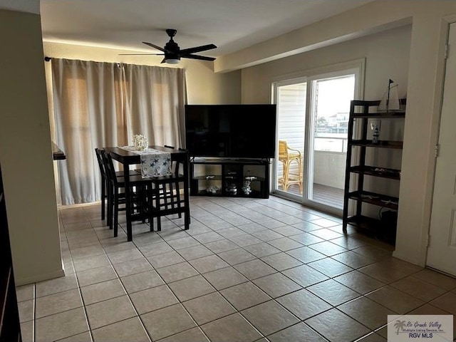 tiled dining area featuring ceiling fan