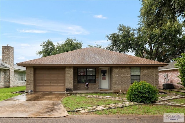 single story home featuring brick siding, an attached garage, concrete driveway, and a shingled roof