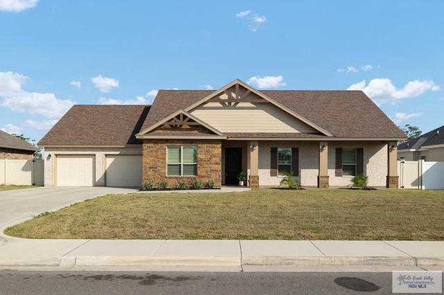 craftsman-style home with a garage and a front lawn