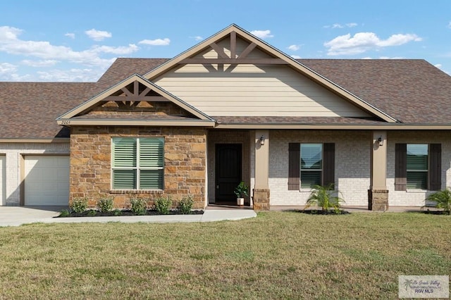 craftsman-style house with a garage and a front lawn