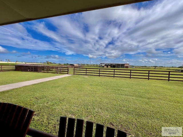 view of yard with a rural view