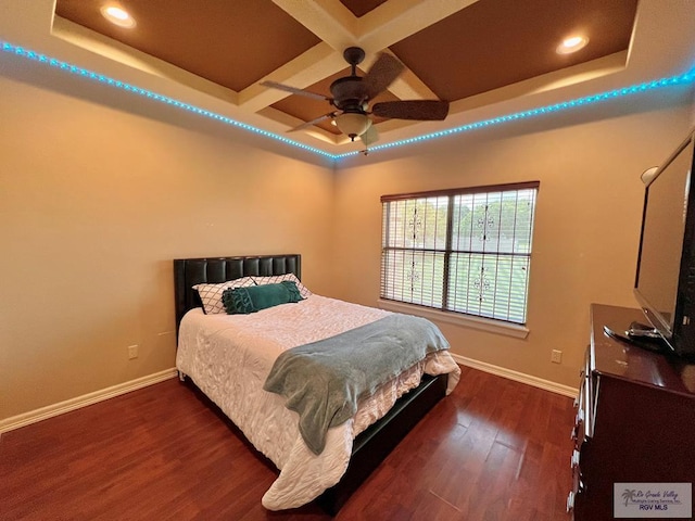 bedroom with beamed ceiling, dark hardwood / wood-style floors, ceiling fan, and coffered ceiling