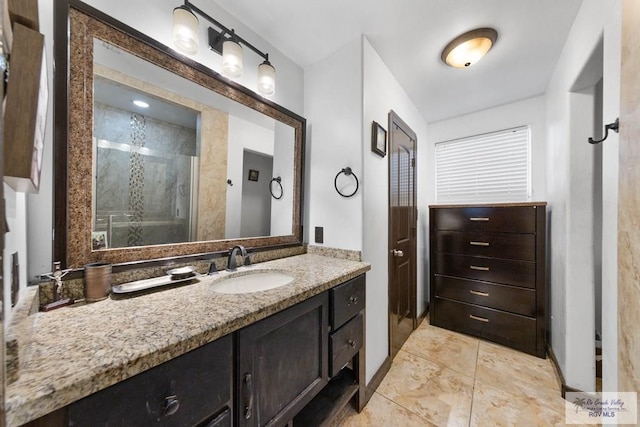 bathroom with vanity and an enclosed shower