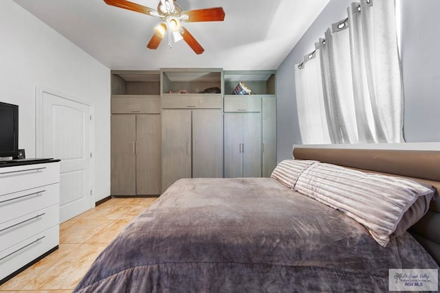 bedroom featuring ceiling fan and light tile patterned floors