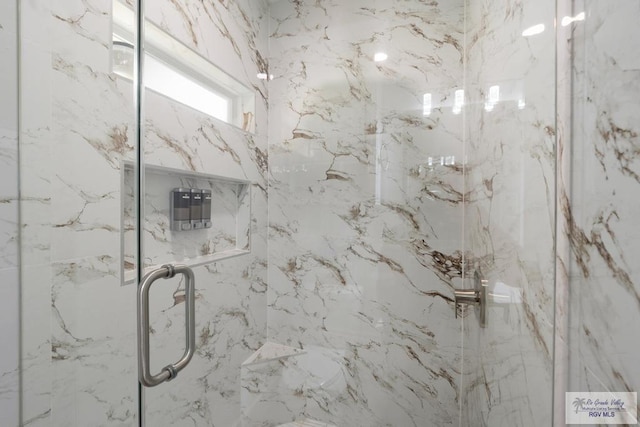 9073 New Orleans Ct, Los Fresnos, TX 78566 - bathroom featuring a marble finish shower