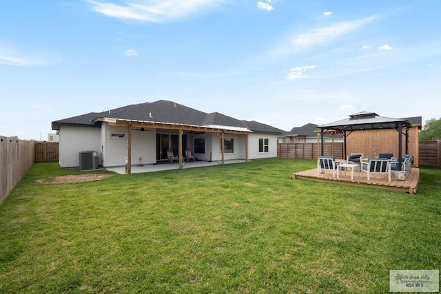 9073 New Orleans Ct, Los Fresnos, TX 78566 - rear view of property with central AC, a gazebo, a wooden deck, a ceiling fan, and a patio