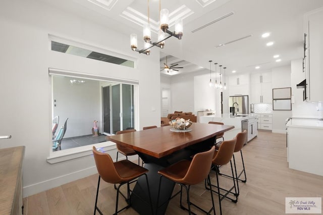 9073 New Orleans Ct, Los Fresnos, TX 78566 - dining space with a chandelier, light wood finished floors, recessed lighting, baseboards, and a ceiling fan