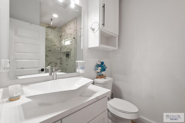 9073 New Orleans Ct, Los Fresnos, TX 78566 - bathroom featuring a marble finish shower, vanity, and toilet
