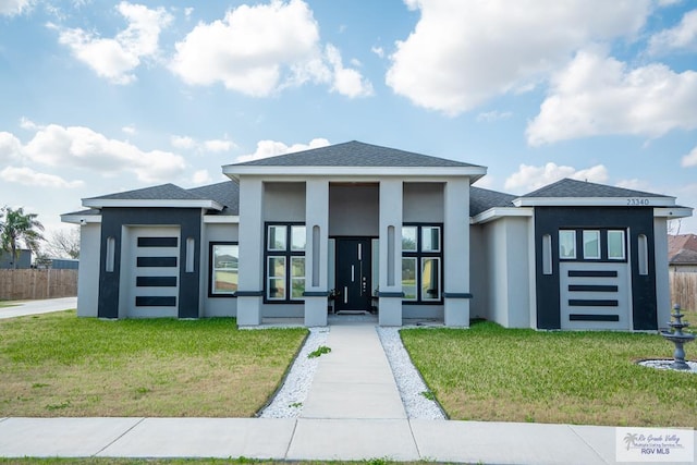 prairie-style home featuring a front yard